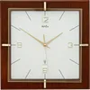 A square wall clock with a wooden frame and a white face. Produktbild-Vorschau
