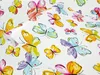 A white background filled with a pattern of colorful, hand-painted butterflies. Produktbild-Vorschau