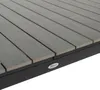 Close-up view of a gray slatted surface with a black frame and a small logo. Náhled obrázku produktu