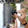A person's hands are shown adjusting the control knob of a patio heater. Produktbild-Vorschau