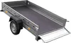 A grey utility trailer with a black floor and ramp, shown from a diagonal angle. Náhled obrázku produktu