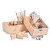 Two wooden storage crates filled with art supplies, including paint bottles, brushes, pencils, scissors, and twine. Náhled obrázku produktu