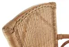 A close-up view of the woven rattan back and armrest of a chair. Produktbild-Vorschau