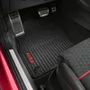 Interior view of a car's driver's side floor with custom floor mats. Produktbild-Vorschau