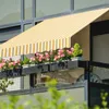 A balcony with a striped awning and flower boxes filled with pink flowers. Náhled obrázku produktu