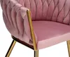 A close-up view of a pink velvet armchair with gold legs. Produktbild-Vorschau