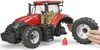A toy tractor with a wheel being removed by a person's hands. Podgląd zdjęcia produktu