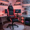 A gaming setup with a gaming chair, computer, and desk, illuminated by red LED lighting. Náhled obrázku produktu