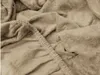 A close-up view of a beige terry cloth bed sheet, showing the texture of the fabric and the elasticated edge. Náhled obrázku produktu