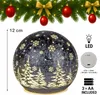 A decorative Christmas ball with a winter forest scene and snowflakes, set against a festive fir garland. Produktbild-Vorschau