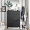 A hallway or entryway with a shoe cabinet, mirror, lamp, and coats hanging on the wall. Náhľad obrázku produktu