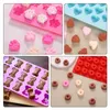 A collage of four images showing silicone molds and dog treats in various shapes. Produktbild-Vorschau