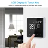 A hand is shown touching a digital thermostat mounted on a wall, with a room interior visible in the background. Náhľad obrázku produktu
