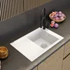 A modern kitchen sink with a black faucet and a bowl of figs on the countertop. Podgląd zdjęcia produktu