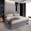 A modern bedroom with a large bed as the focal point. Produktbild-Vorschau