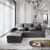 A modern living room with a sectional sofa, coffee table, and staircase in the background. Produktbild-Vorschau