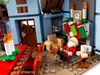 A LEGO® set depicting a cozy Christmas scene with Santa Claus, stockings, a fireplace, and a dining table. Podgląd zdjęcia produktu