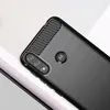 Close-up of the back of a black smartphone case with a carbon fiber texture on the top edge and a brushed metal finish on the main body. The Motorola logo is visible in the center. Podgląd zdjęcia produktu