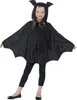 A young girl wearing a black bat costume with wings and a hood with ears and fangs. Voir les images du produit