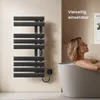 A woman relaxing in a bathtub next to a black electric towel warmer. Náhľad obrázku produktu