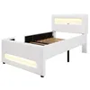 A white bed frame with integrated LED lighting, shown from a side-angle. Produktbild-Vorschau