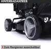 Close-up view of the rear wheels and part of the engine of a lawnmower. Produktbild-Vorschau
