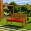 A wooden bench with a red cushion sits on a green lawn in a backyard setting, with a hammock and pergola in the background. Produktbild-Vorschau
