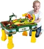 A young boy is playing with a John Deere farm-themed sand and water play table. Produktbild-Vorschau