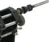 A close-up view of the gears and threaded rod of a winding machine. Náhled obrázku produktu