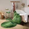 A bathroom scene with bath mats and towels. Produktbild-Vorschau