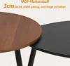 Close-up of two round tables, one with a wood-grain finish and the other in matte black, showcasing their surface and legs. Produktbild-Vorschau