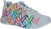 A white sneaker with colorful heart designs. Voir les images du produit