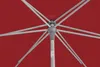 A close-up view of the internal mechanism and fabric of a red umbrella. Produktbild-Vorschau
