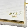 A close-up view of a Harry Potter themed notebook with a plush cover and a golden owl illustration. Produktbild-Vorschau