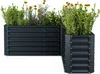 Two dark gray, L-shaped raised garden beds filled with green plants and yellow flowers, set against a white background. Náhľad obrázku produktu
