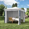 A garden gazebo set up in a grassy backyard with a table and chairs inside. Produktbild-Vorschau