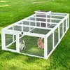 Two rabbits are inside a large white outdoor enclosure with a wooden house on top. Produktbild-Vorschau