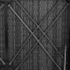A close-up view of a woven rattan-like material with diagonal reinforcing bars. Náhľad obrázku produktu