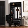 A hallway storage unit with a bench and shoe storage, near a door and sofa. Produktbild-Vorschau