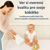 A woman places a white cloth into a crib where a baby is sitting, with text overlay. Náhľad obrázku produktu
