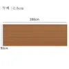 A brown wood-like textured mat with black lines, with dimensions indicated. Podgląd zdjęcia produktu
