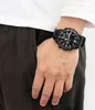 A person's wrist wearing a black Casio Edifice Bluetooth watch. Voir les images du produit