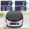 A digital kitchen scale with multiple display units shown in the background, and a finger pressing a button on the scale. Produktbild-Vorschau