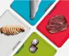 A collage of four cutting boards, each with a different food item on it: fish, steak, chicken, and onions. Podgląd zdjęcia produktu