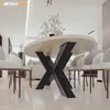 A modern dining room with a round table and chairs. Produktbild-Vorschau