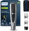 A product shot of a Philips hair clipper and its accessories, presented on its packaging. Náhled obrázku produktu