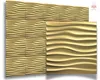 A display of gold-colored 3D wall panels with a wavy pattern. Produktbild-Vorschau