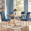 A dining room scene with a wooden table and four blue upholstered chairs. Produktbild-Vorschau