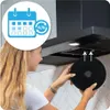 A woman is shown installing a carbon filter into a range hood. Voir les images du produit
