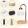 A collage of images showing the components and the assembled product of a candle warmer lamp. Náhled obrázku produktu